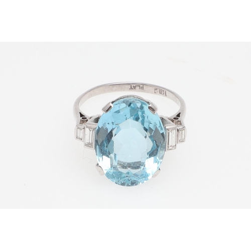 1117 - AN AQUAMARINE AND DIAMOND RING. the oval-shaped aquamarine is set with two baguette-cut diamonds to ... 