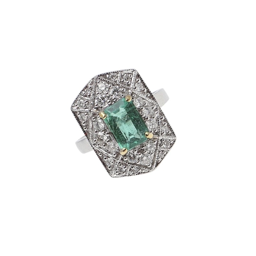 1119 - AN EMERALD AND DIAMOND CLUSTER RING. the cut-cornered rectangular-shaped emerald weighs approximatel... 