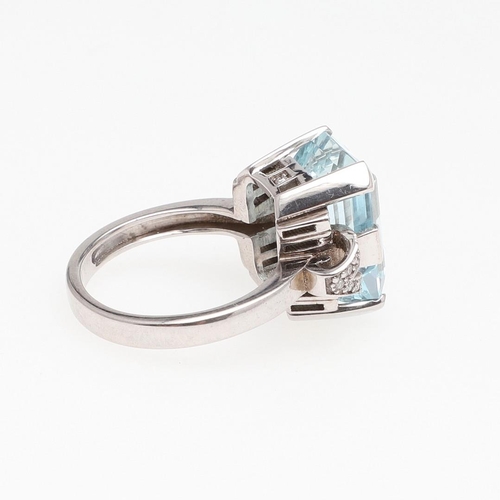 1125 - AN AQUAMARINE AND DIAMOND RING. the step-cut aquamarine is set with circular-cut diamonds to each sh... 