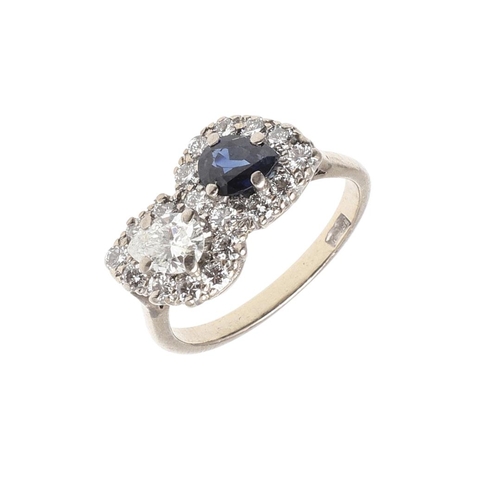 1129 - A SAPPHIRE AND DIAMOND DOUBLE CLUSTER RING. set with a pear-shaped diamond and sapphire each set wit... 