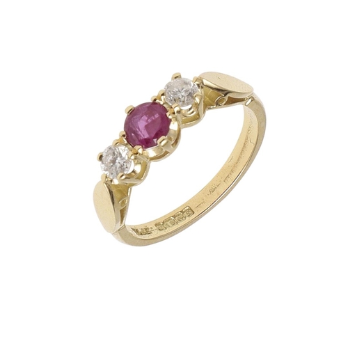 1134 - A RUBY AND DIAMOND THREE STONE RING. the circular-cut ruby is set with two brilliant-cut diamonds, i... 