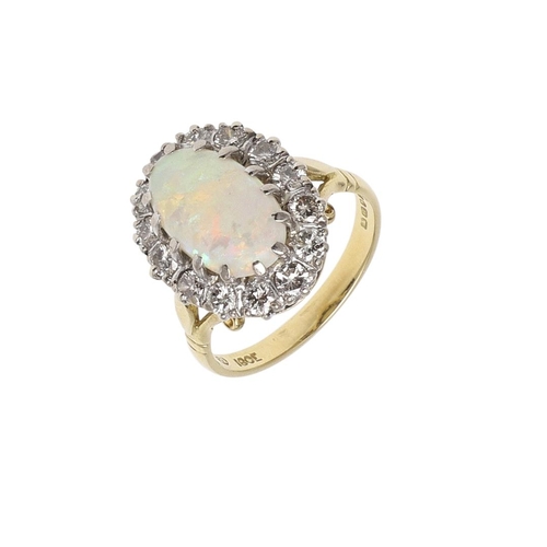 1139 - AN OPAL AND DIAMOND CLUSTER RING. the oval-shaped solid white opal is set within a surround of circu... 