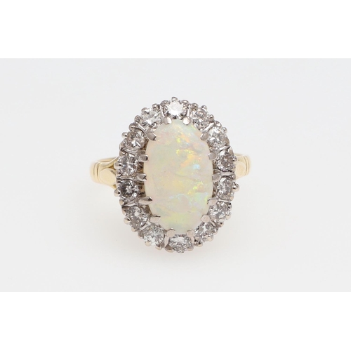 1139 - AN OPAL AND DIAMOND CLUSTER RING. the oval-shaped solid white opal is set within a surround of circu... 