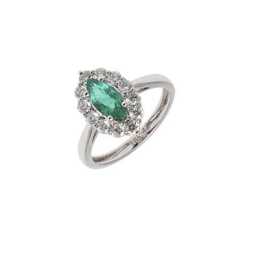 1140 - AN EMERALD AND DIAMOND CLUSTER RING. the marquise-shaped emerald is set within a surround of round b... 