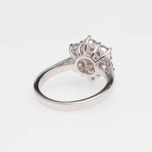 1141 - A DIAMOND CLUSTER RING. of flowerhead form, set with seven circular-cut diamonds in 18ct gold, 6.0 g... 