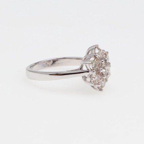 1141 - A DIAMOND CLUSTER RING. of flowerhead form, set with seven circular-cut diamonds in 18ct gold, 6.0 g... 