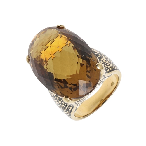 1142 - A LARGE CITRINE DRESS RING. the large oval faceted citrine set in 18ct gold with black enamelled sho... 