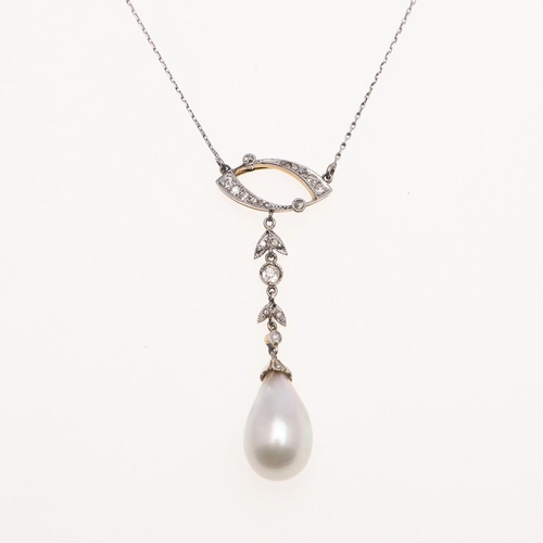 1148 - AN EDWARDIAN NATURAL PEARL AND DIAMOND PENDANT. the natural pearl drop is suspended from a foliate l... 