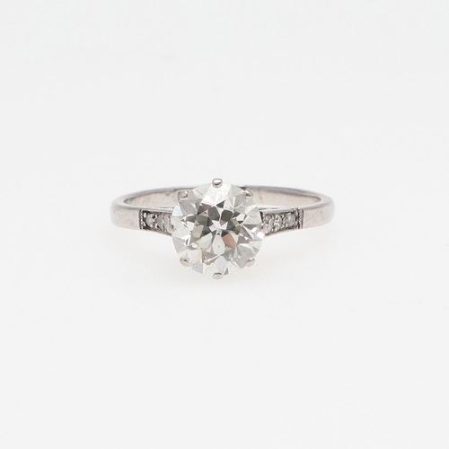 1150 - AN EDWARDIAN DIAMOND SOLITAIRE RING. the round old-cut diamond weighs approximately 1.90 carats and ... 