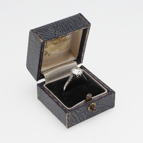 1150 - AN EDWARDIAN DIAMOND SOLITAIRE RING. the round old-cut diamond weighs approximately 1.90 carats and ... 