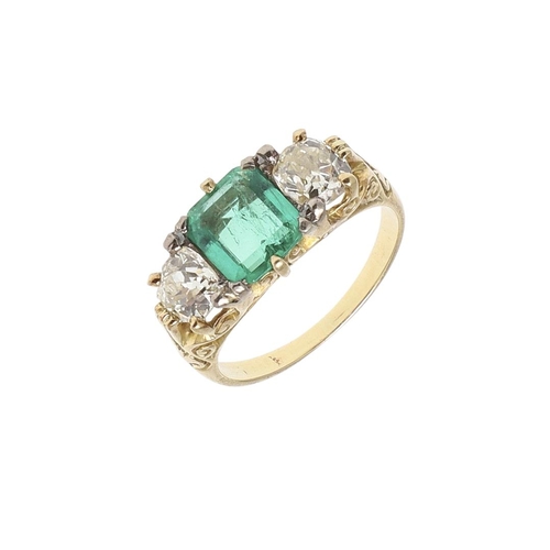 1151 - A COLOMBIAN EMERALD AND DIAMOND THREE STONE RING. the rectangular-shaped emerald is set with two cus... 