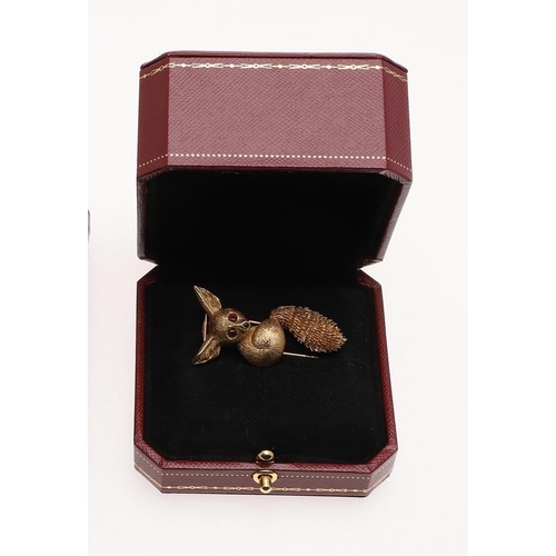 1156 - AN 18CT GOLD FENNEC FOX BROOCH BY CARTIER. realistically formed, with ruby eyes, signed Cartier Pari... 