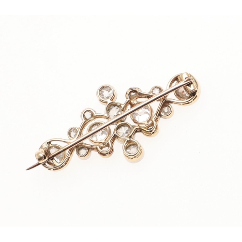 1157 - AN EARLY 20TH CENTURY DIAMOND BROOCH. mounted with collet set circular old-cut diamonds and rose-cut... 