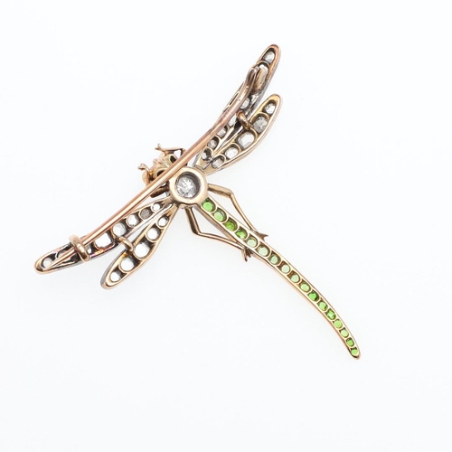 1159 - AN EARLY 20TH CENTURY DIAMOND AND DEMANTOID GARNET DRAGONFLY BROOCH. the body mounted with circular-... 