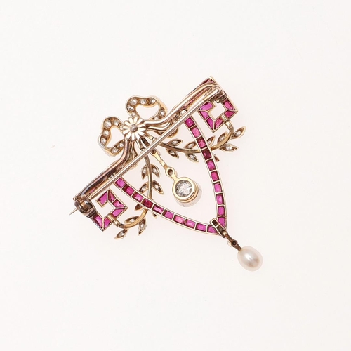 1161 - A BELLE EPOQUE RUBY AND DIAMOND BROOCH PENDANT. the openwork mount is set with calibre-cut rubies, w... 