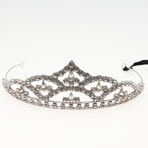 847 - A PASTE SET TIARA. set overall with circular and pear-shaped paste stones, in white metal, 5.0cm hig... 