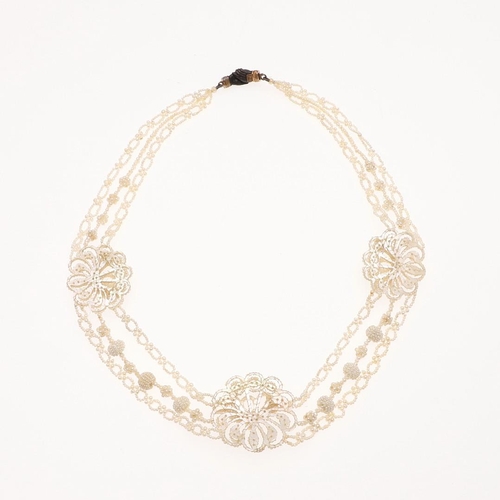 849 - A GEORGIAN SEED PEARL NECKLACE, EARLY 19TH CENTURY. formed with seed pearls with mother of pearl fre... 