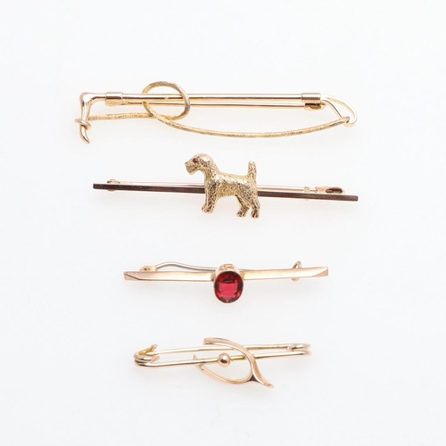 853 - A 9CT GOLD TERRIER BROOCH. realistically formed with ruby eye, 5.2cm long, together with a 9ct gold ... 