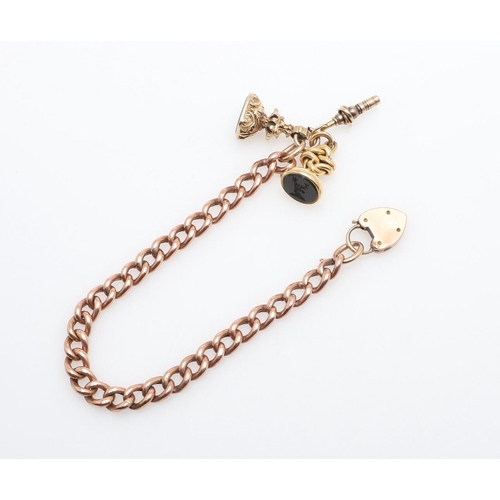 855 - A GOLD CURB LINK BRACELET. with gold padlock clasp, suspending two gold seals, one with a bloodstone... 