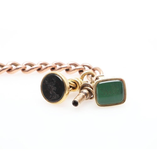 855 - A GOLD CURB LINK BRACELET. with gold padlock clasp, suspending two gold seals, one with a bloodstone... 