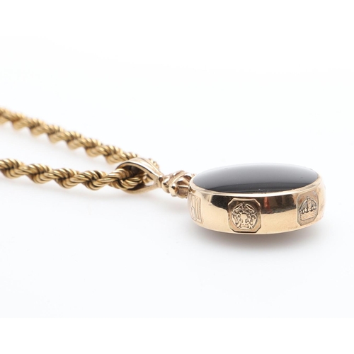 857 - A 9CT GOLD FOB. mounted with black onyx to one side, agate to the other, on a 9ct gold rope link cha... 