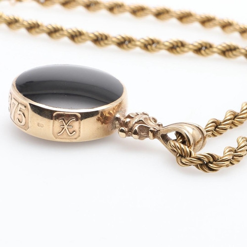 857 - A 9CT GOLD FOB. mounted with black onyx to one side, agate to the other, on a 9ct gold rope link cha... 