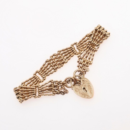 860 - A 9CT GOLD FANCY GATE LINK BRACELET. with foliate engraved padlock clasp, 17cm long, 22.6 grams.  *C... 