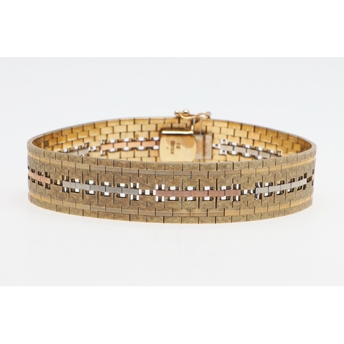 863 - A 9CT THREE COLOUR GOLD BRACELET. of geometric openwork design with engraved decoration, with concea... 