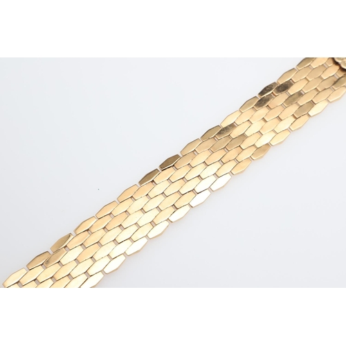 865 - AN 18CT GOLD PANEL BRACELET. formed with undulating plain and foliate engraved links to a concealed ... 