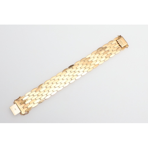 865 - AN 18CT GOLD PANEL BRACELET. formed with undulating plain and foliate engraved links to a concealed ... 