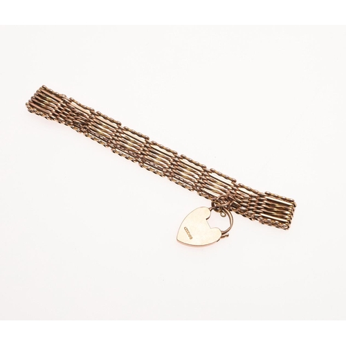 867 - A 9CT GOLD GATE LINK BRACELET. with padlock clasp, 18cm long, 22.3 grams.  *Condition:  With some we... 