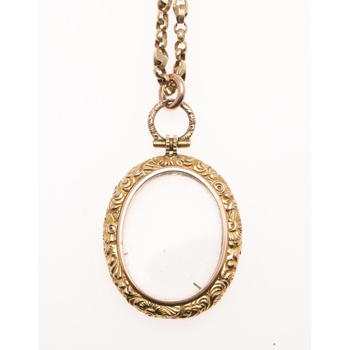 875 - A 9CT GOLD LOCKET PENDANT. with foliate engraved decoration, 3cm wide, on a 9ct gold chain, 49.5cm l... 