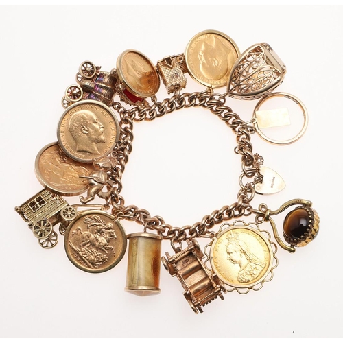 878 - A 9CT GOLD CURB LINK CHARM BRACELET. mounted with many assorted gold charms, including five gold sov... 