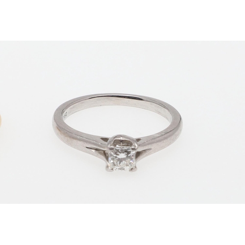 888 - A DIAMOND SOLITAIRE RING. mounted with a cushion-shaped diamond, 2.5 grams, in 18ct gold and platinu... 