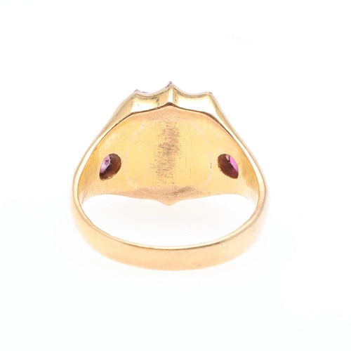 894 - A RUBY AND GOLD SIGNET RING. mounted with a vacant shield-shaped ruby in yellow gold, with a circula... 