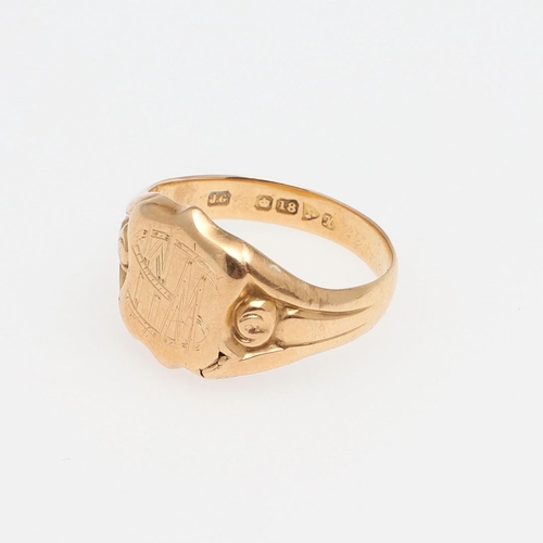 899 - AN 18CT GOLD SIGNET RING. engraved with initials and with fluted shoulders, 4.1 grams, size R, toget... 