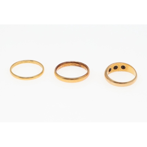 900 - A 22CT GOLD WEDDING BAND. 4.9 grams, size Q, together with another 22ct gold wedding band, 2.5 grams... 