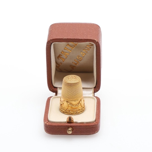 902 - A GOLD THIMBLE. with embossed foliate and swag decoration, 2.3cm high, 5.0 grams.  *Condition:  No o... 