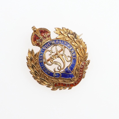 921 - A 14CT GOLD AND ENAMEL REGIMENTAL BROOCH FOR THE ROYAL ENGINEERS. With blue and red enamel decoratio... 