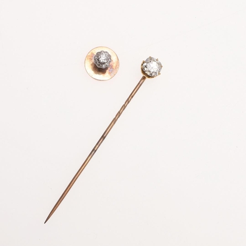 923 - A DIAMOND AND GOLD STICK PIN. mounted with an old cushion-shaped diamond, together with a diamond an... 