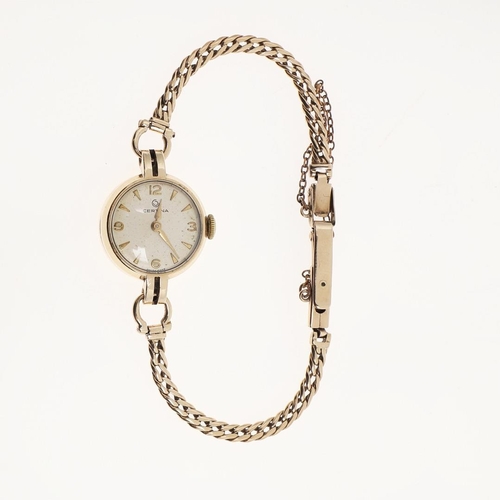 933 - A LADY'S 9CT GOLD WRISTWATCH BY CERTINA. the signed circular dial with Arabic quarters and dagger nu... 