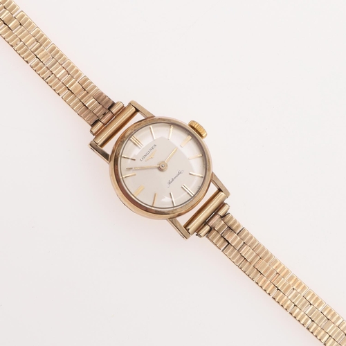 935 - A LADY'S 9CT GOLD WRISTWATCH BY LONGINES. the signed circular dial with baton numerals, Longines log... 