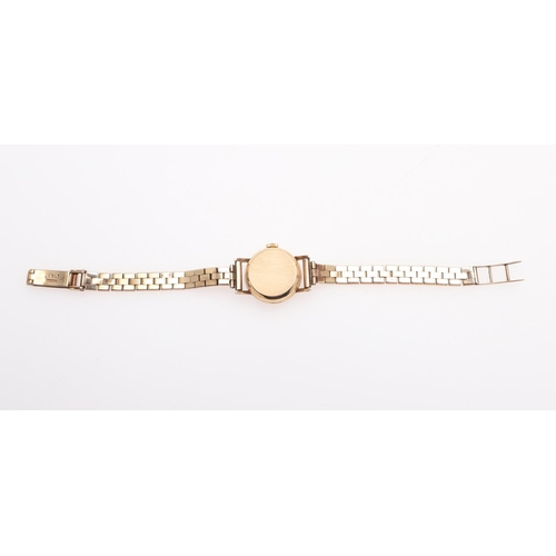 935 - A LADY'S 9CT GOLD WRISTWATCH BY LONGINES. the signed circular dial with baton numerals, Longines log... 