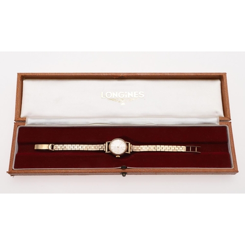 935 - A LADY'S 9CT GOLD WRISTWATCH BY LONGINES. the signed circular dial with baton numerals, Longines log... 