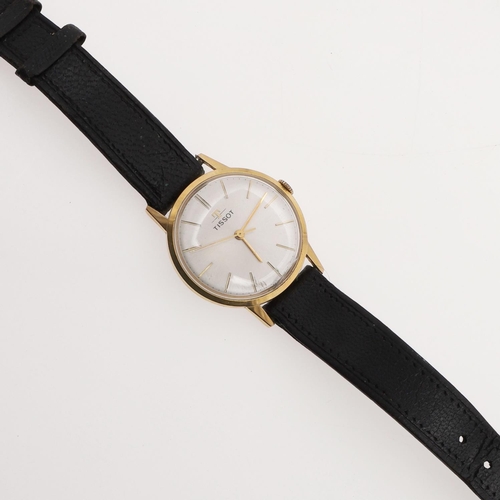 944 - A GENTLEMAN'S STAINLESS STEEL AND GOLD PLATED WRISTWATCH BY TISSOT. the signed circular dial with ba... 