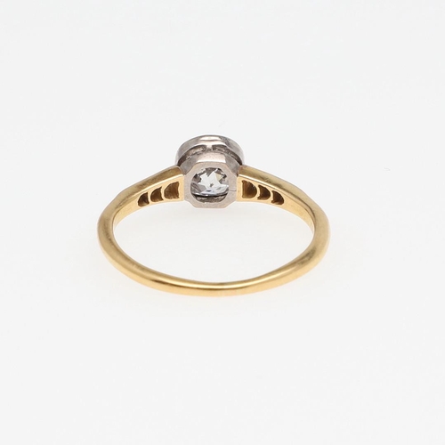 964 - A DIAMOND SOLITAIRE RING. collet set with an old-cut diamond, with rose-cut diamonds set to each sho... 