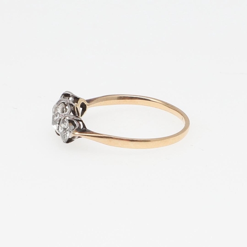 965 - A DIAMOND THREE STONE RING. mounted with three old-cut diamonds, in gold, 1.9 grams. Size O.  *Condi... 