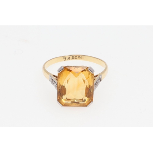 966 - A CITRINE AND DIAMOND RING. the cut-cornered rectangular-shaped citrine is set with three small diam... 