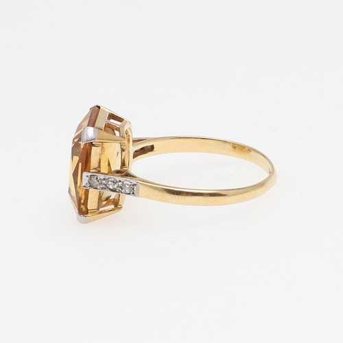 966 - A CITRINE AND DIAMOND RING. the cut-cornered rectangular-shaped citrine is set with three small diam... 