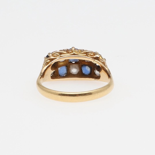 968 - A SAPPHIRE AND DIAMOND TWO ROW RING. alternately set with circular-cut sapphires and circular old-cu... 